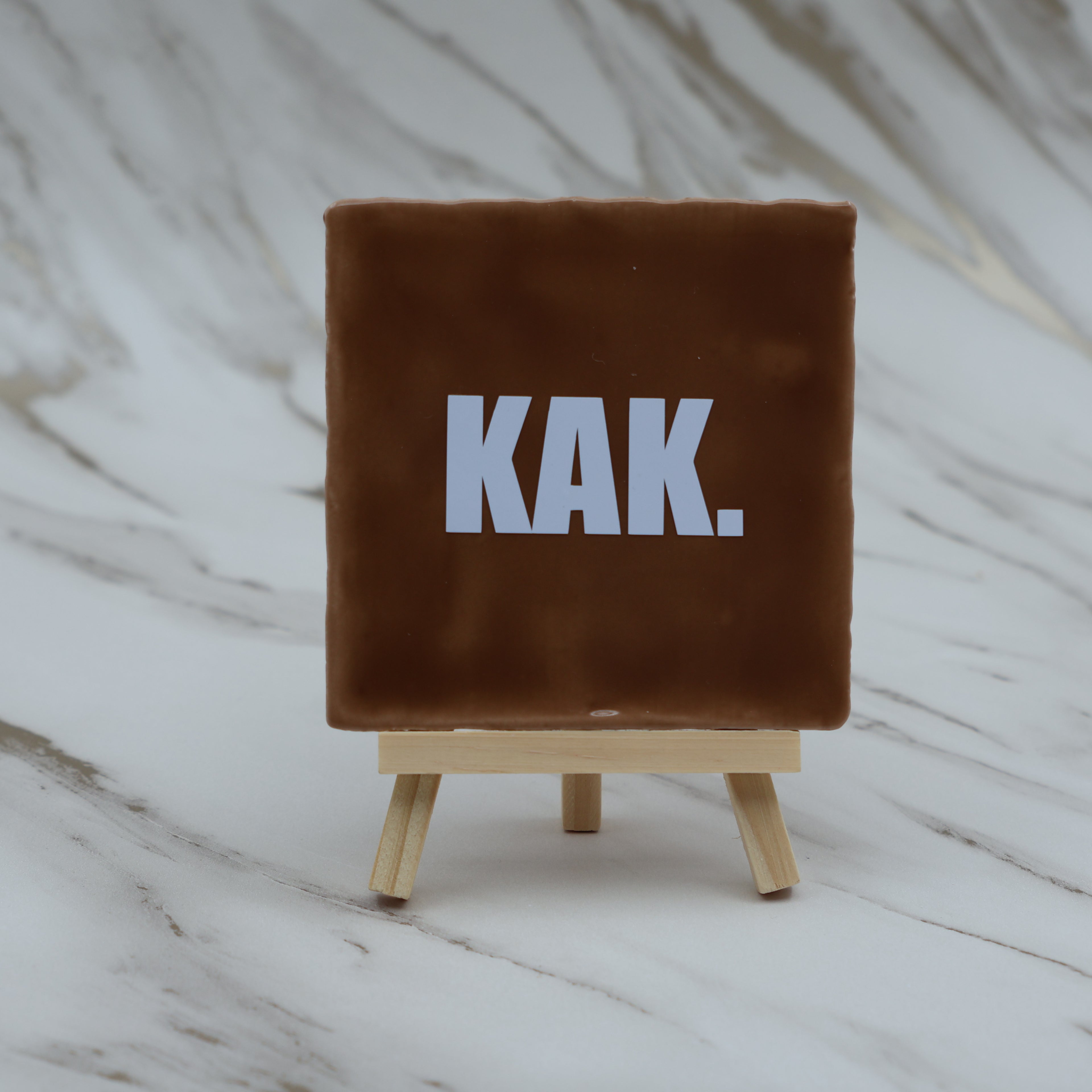 Tegeltje KAK.